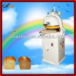 Dough divider and rounder in baking machine-
