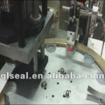 cap wad inserting machine with gluing system