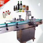 Automatic round bottle label applicator
