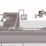 Auto thermoforming and vacuum packing machine