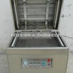 movable vacuum open cover type packaging machine