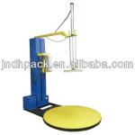 Top plate stretch pallet wrapping machine