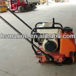 Reversible vibrating plate compactor