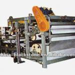 Fabric belt filter press for paper sludge