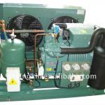 Industrial refrigeration equipment with semi-hermetic reciprocating compressor