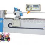 Automatic fabric roll cutter
