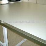 Spreading and cutting table-