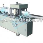 Automatic consecutive nonwoven fabric perforating and folding machine