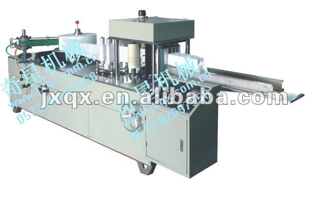 Automatic consecutive nonwoven fabric perforating and folding machine