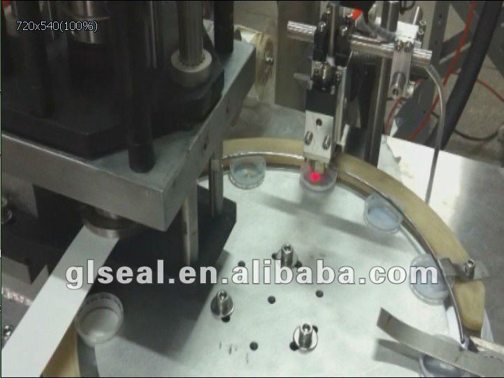 cap wad inserting machine with gluing system
