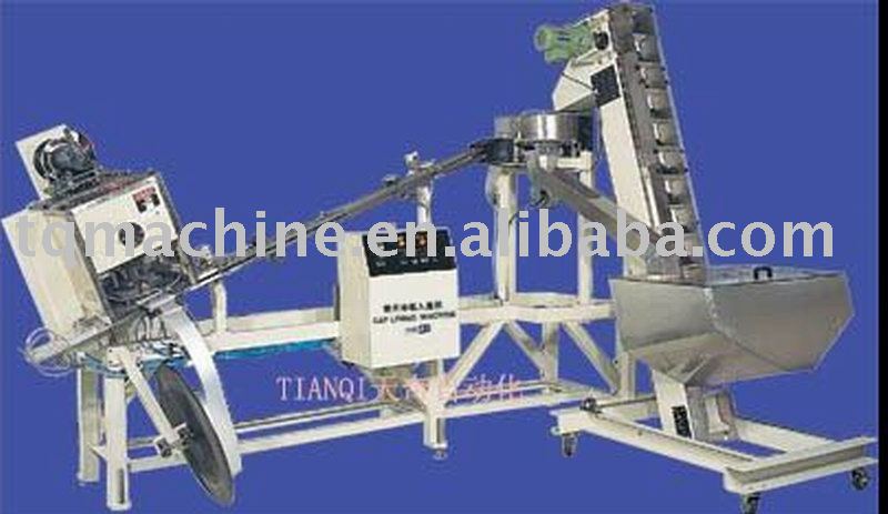 cut and insert cap lining machine