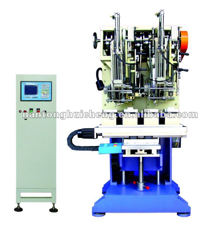 Double head high speed flat wire tufting machine