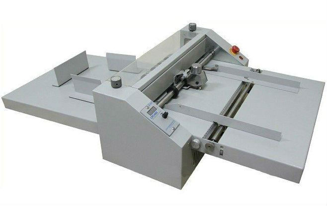 Paper creasing and perforating machine