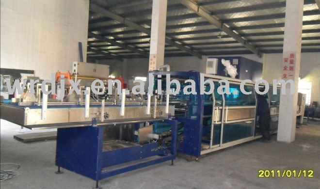 shrink wrapping machine with tray former