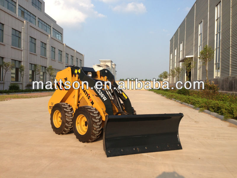 Skid steer loader with dozer snow blade