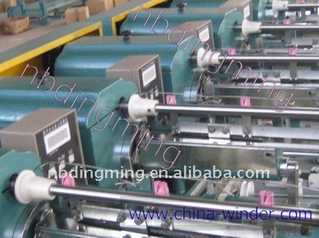 Thread winding machinery for king spool bobbin.