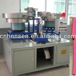 Cloth pegs assembling machine