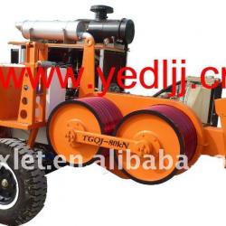 Overhead transmission line bullwheel puller tensioner