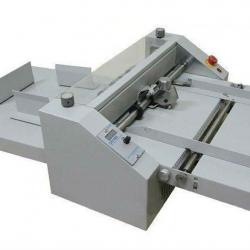 Paper creasing and perforating machine