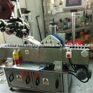 Vertical ampoule labeling machine