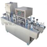 Cup filling and sealing machine