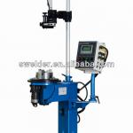 vertical circumferential seam welder with rotary faceplate for circumferential seam welding