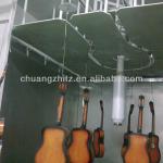 Electrostatic spraying (including UV) for acoustic guitar