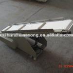 Inclining finished packing product conveyor