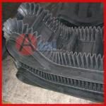 Corrugated sidewall conveyor belt with TC type